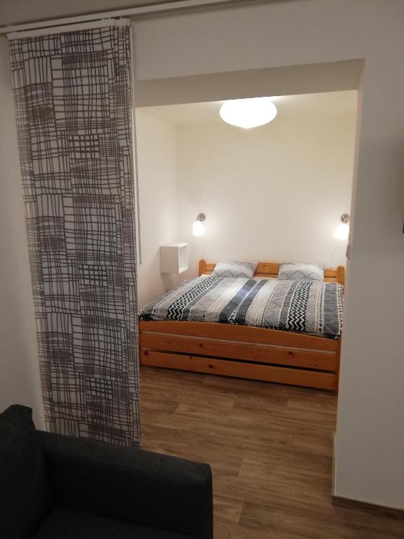 Postel nebo postele na pokoji v ubytování Apartmány pod Divadlem