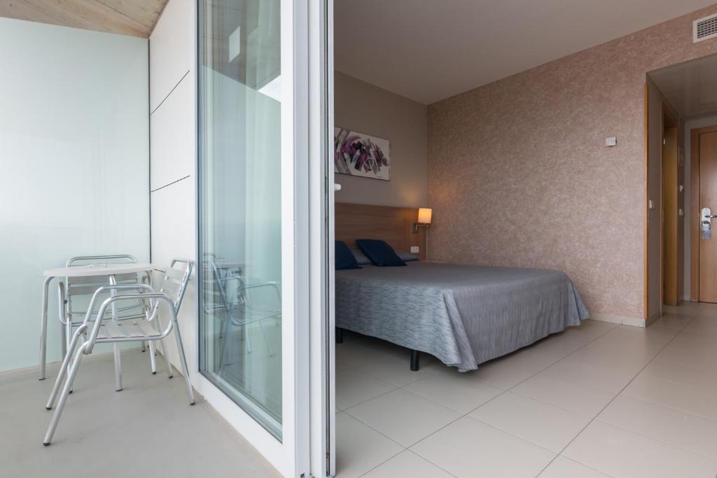 Postel nebo postele na pokoji v ubytování Hotel Lodomar Spa & Talasoterapia