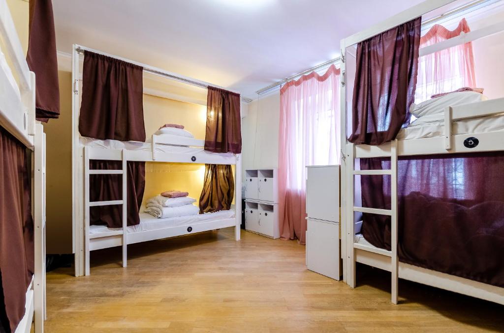 Postel nebo postele na pokoji v ubytování Sun City Hostel 3