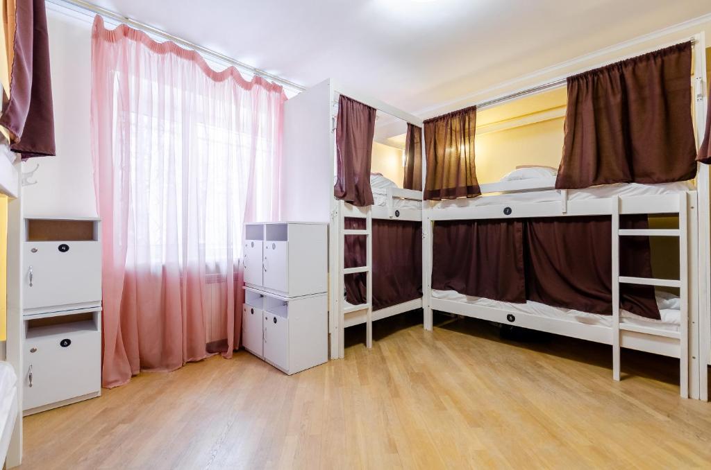 Postel nebo postele na pokoji v ubytování Sun City Hostel 3
