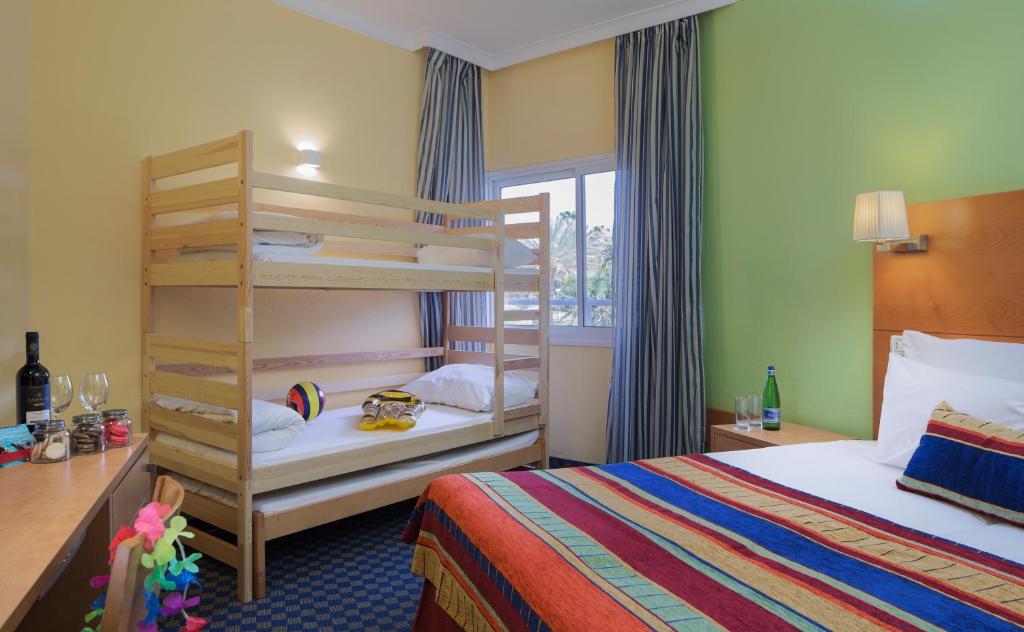 Postel nebo postele na pokoji v ubytování Prima Music Hotel