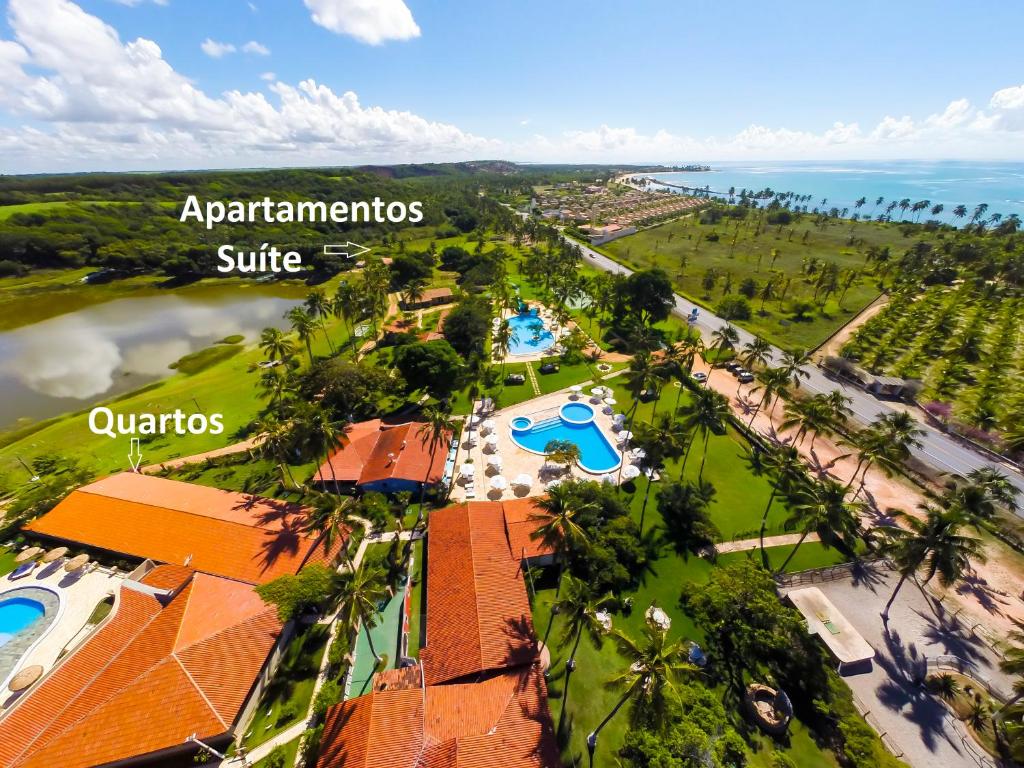 an aerial view of a resort with the ocean at Fazenda Fiore Resort in Paripueira