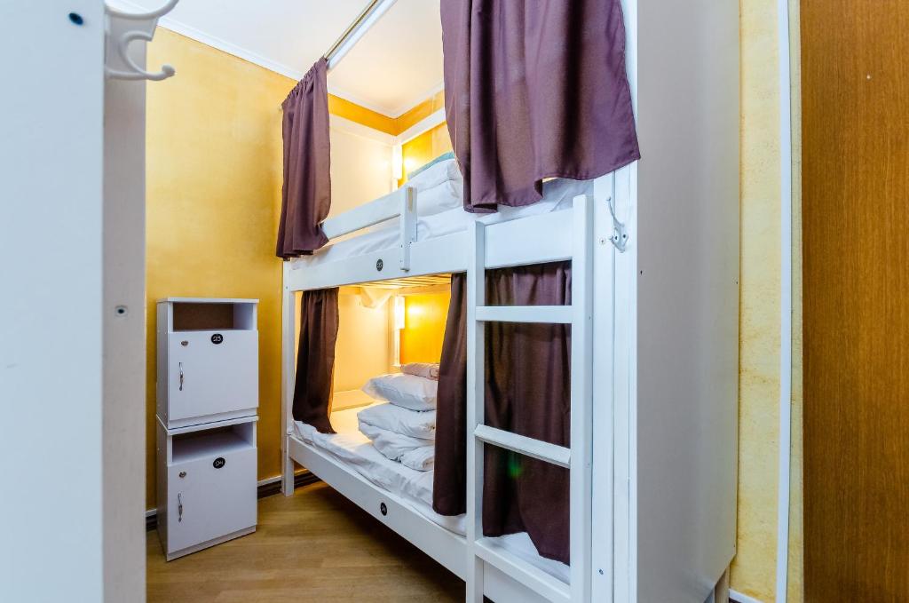 Postel nebo postele na pokoji v ubytování Sun City Hostel 3