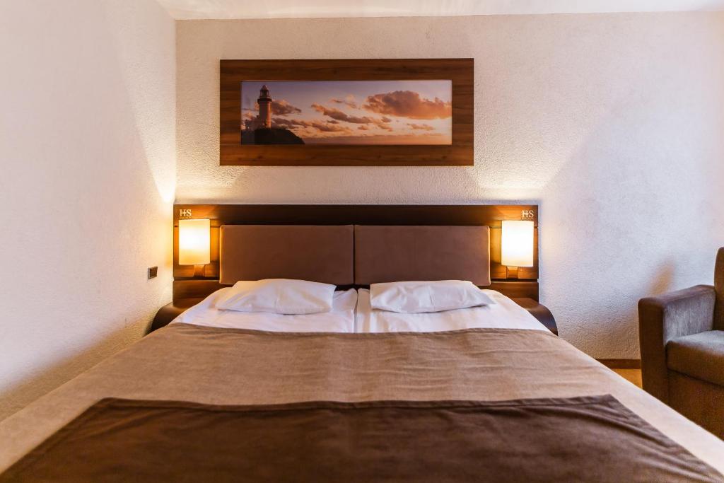 Postel nebo postele na pokoji v ubytování Hotel Solny