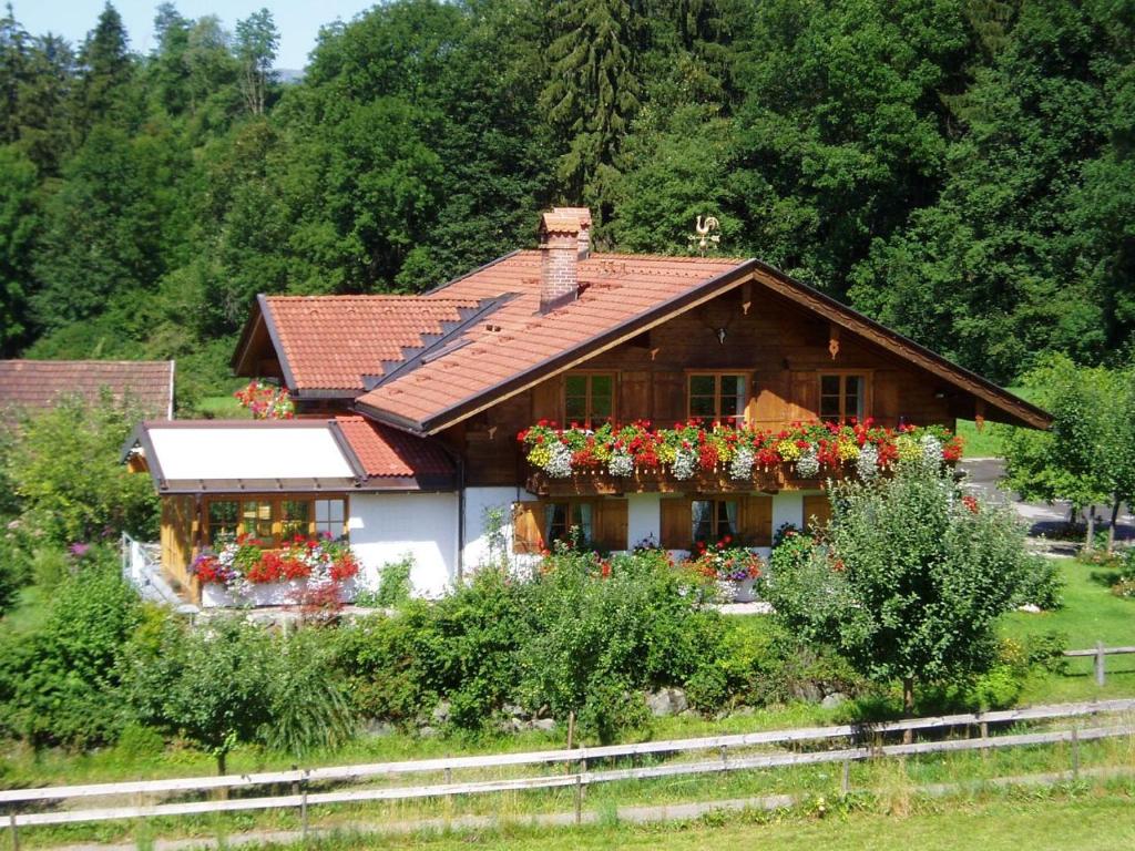a house with flowers in front of it at Landhaus Wankleiten in Bad Hindelang