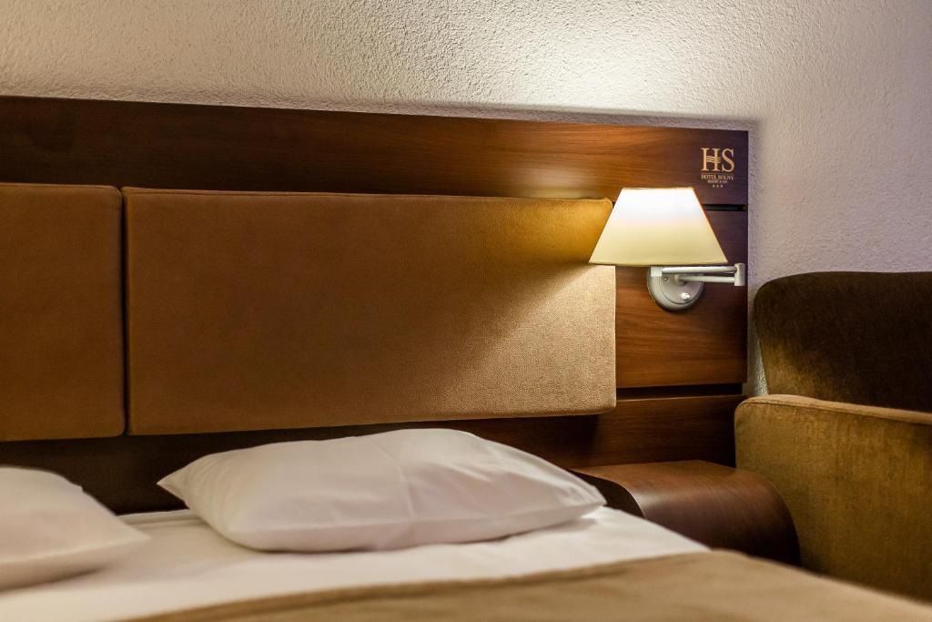 Postel nebo postele na pokoji v ubytování Hotel Solny