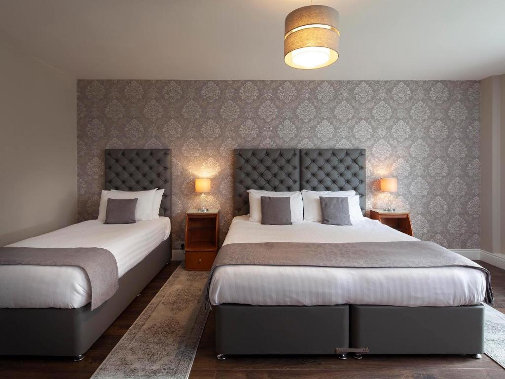 Postel nebo postele na pokoji v ubytování Elfordleigh Hotel