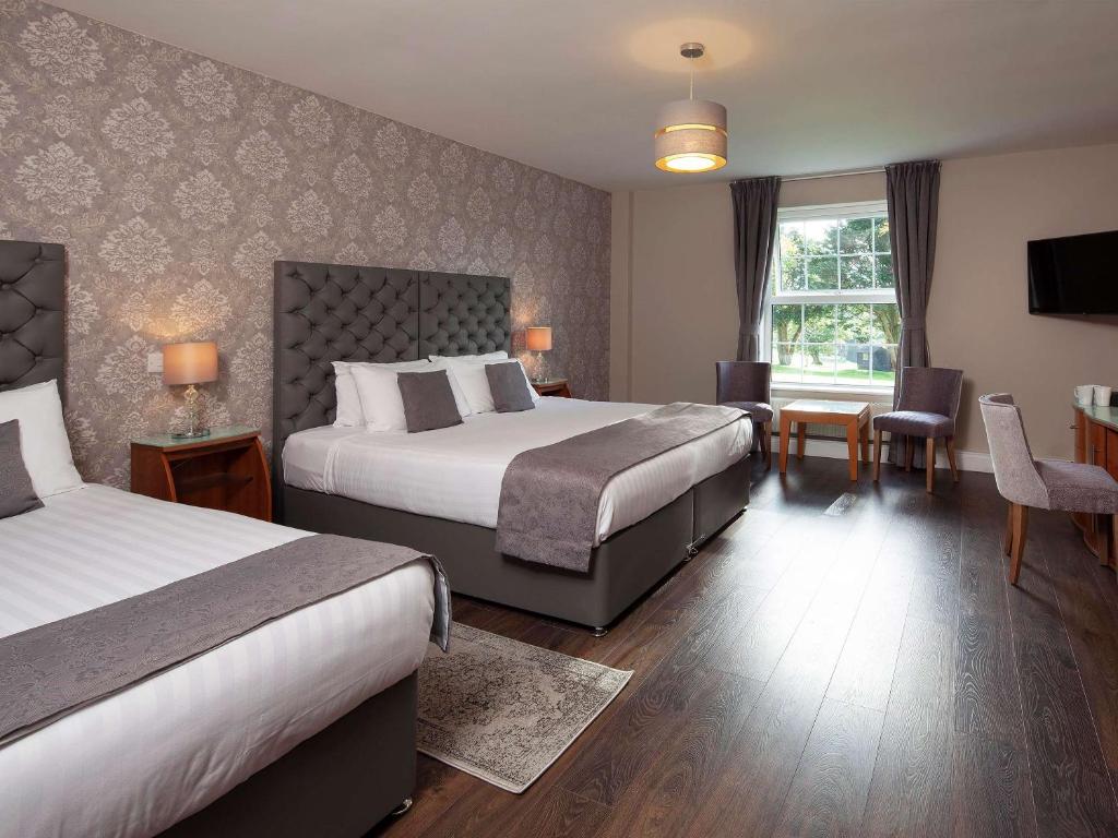 Postel nebo postele na pokoji v ubytování Elfordleigh Hotel