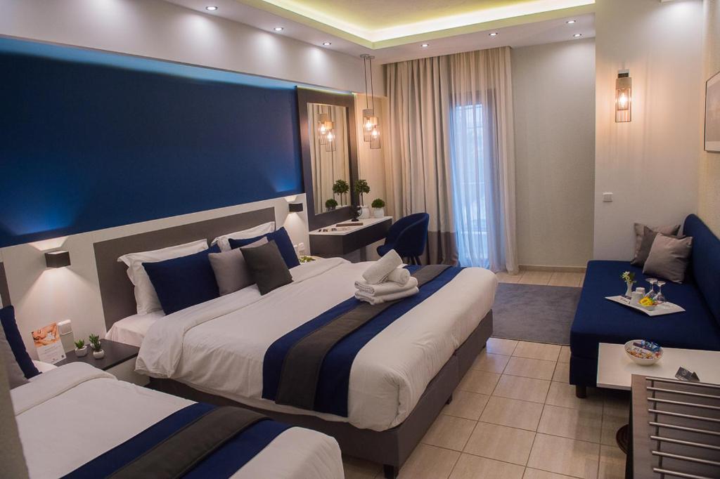 Postel nebo postele na pokoji v ubytování Sokratis Hotel