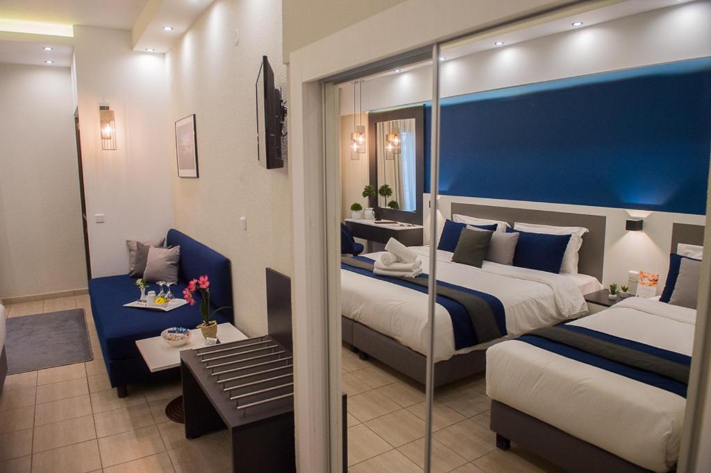 Postel nebo postele na pokoji v ubytování Sokratis Hotel