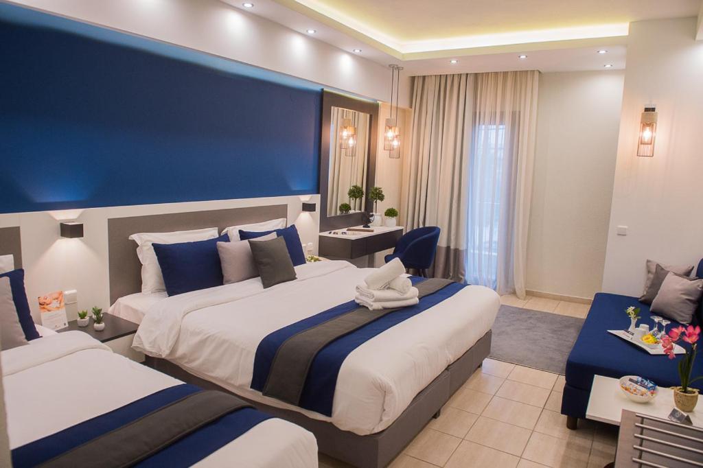 Postel nebo postele na pokoji v ubytování Sokratis Hotel