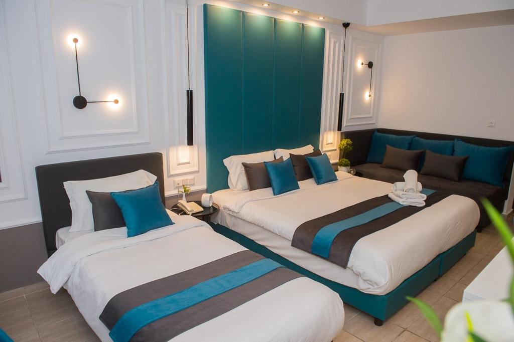 Postel nebo postele na pokoji v ubytování Sokratis Hotel