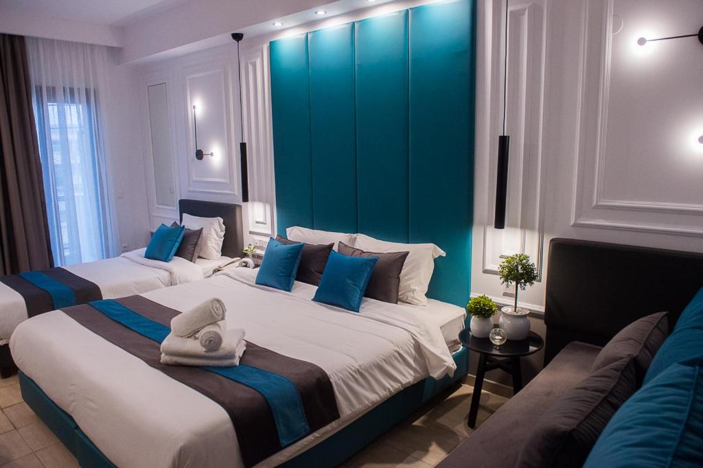 Postel nebo postele na pokoji v ubytování Sokratis Hotel