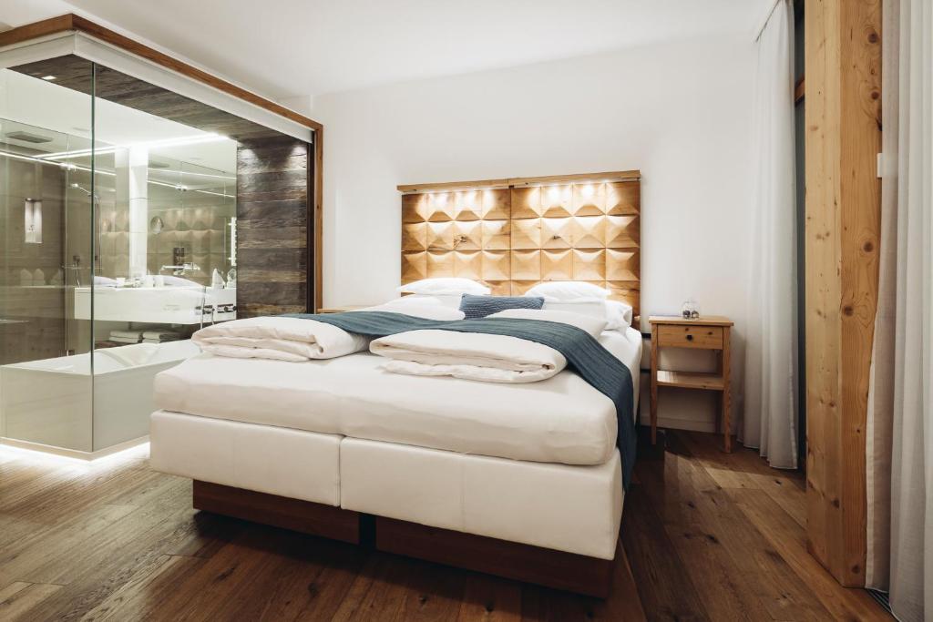 Postel nebo postele na pokoji v ubytování Mooser Hotel