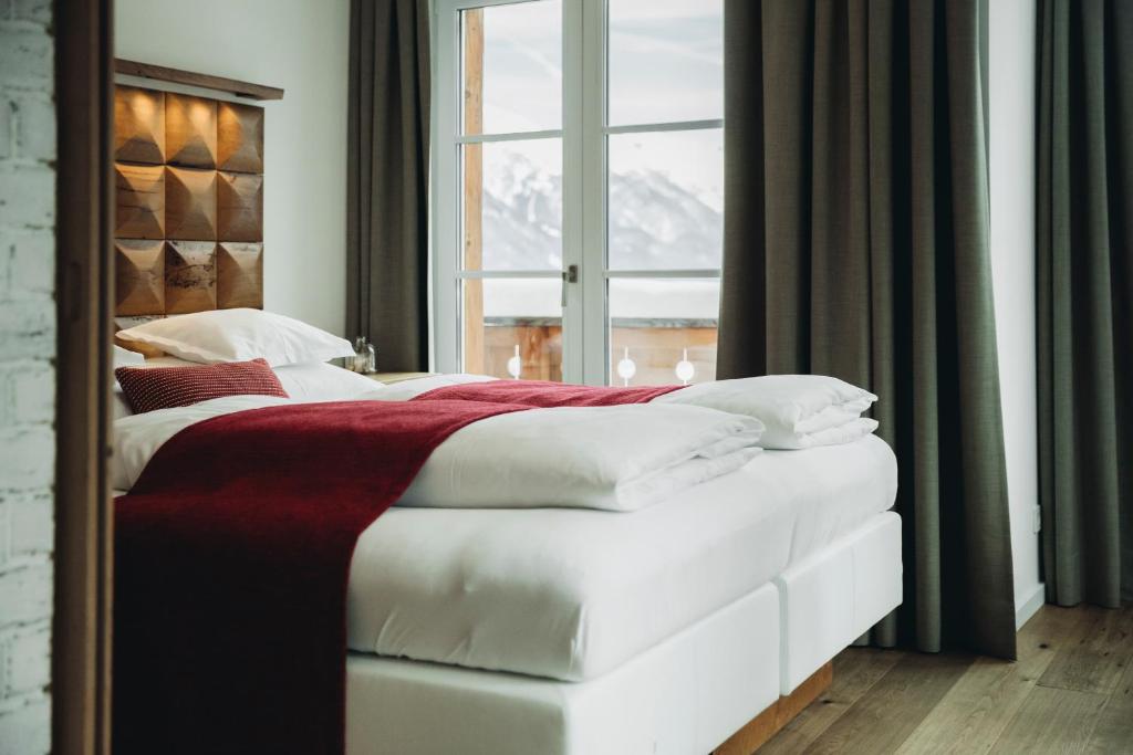 Postel nebo postele na pokoji v ubytování Mooser Hotel