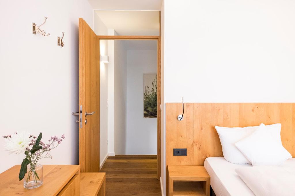 Postel nebo postele na pokoji v ubytování Valschena Appartements