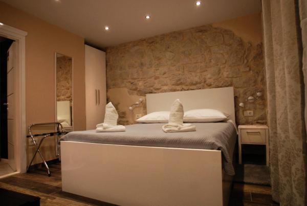 Posteľ alebo postele v izbe v ubytovaní Elegant Residence Rooms