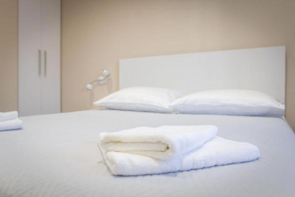 Posteľ alebo postele v izbe v ubytovaní Elegant Residence Rooms