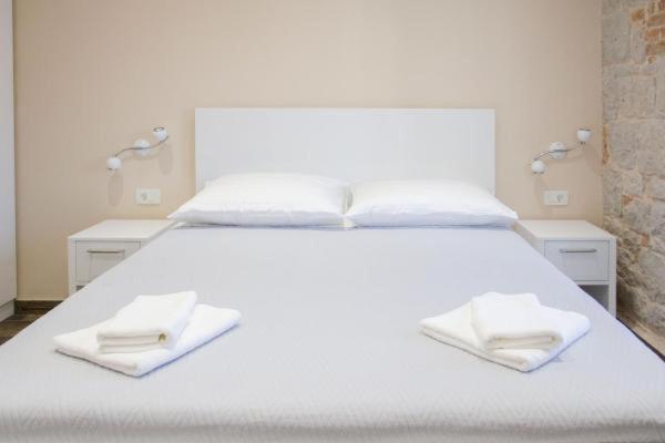 Posteľ alebo postele v izbe v ubytovaní Elegant Residence Rooms