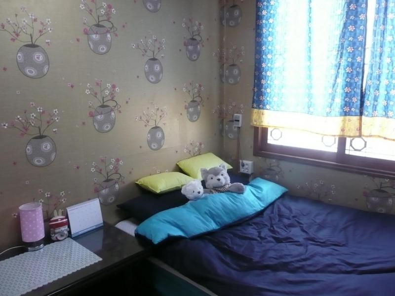 Postel nebo postele na pokoji v ubytování Guesthouse Spring Flower