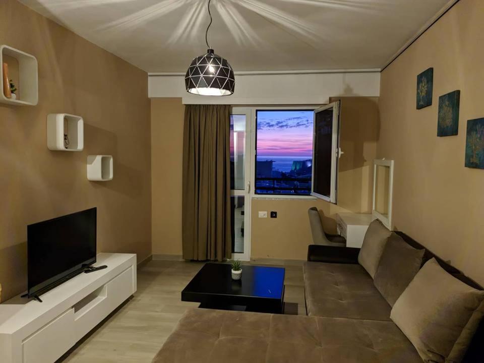 a living room with a couch and a tv at Bella Vista B&B in Ulcinj