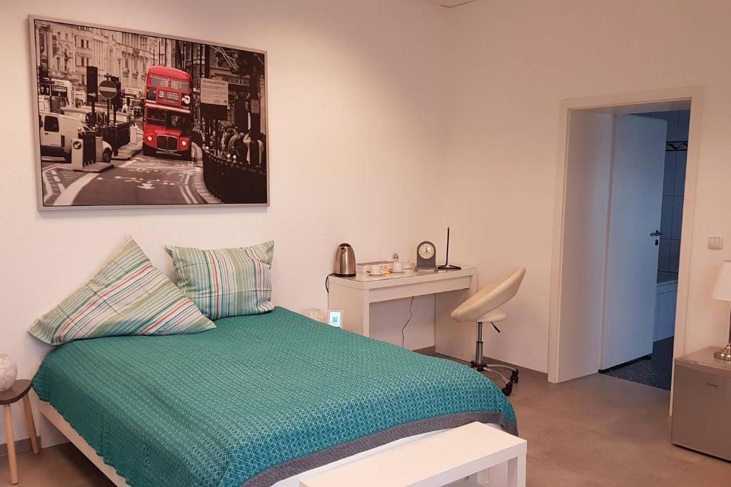 a bedroom with a bed and a red double decker bus at Zimmervermietung Mülheim in Mülheim an der Ruhr