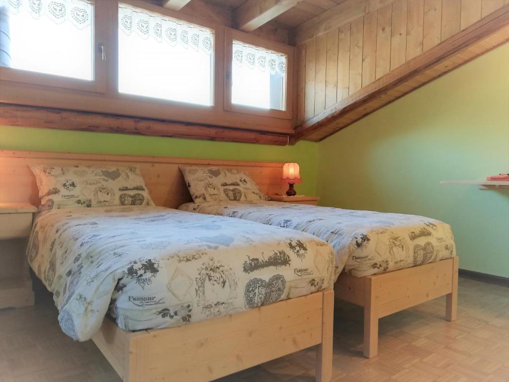 Postel nebo postele na pokoji v ubytování B&B La Genzianella