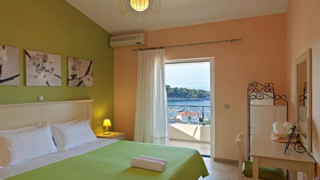 Postel nebo postele na pokoji v ubytování Elaia Boutique Apartments