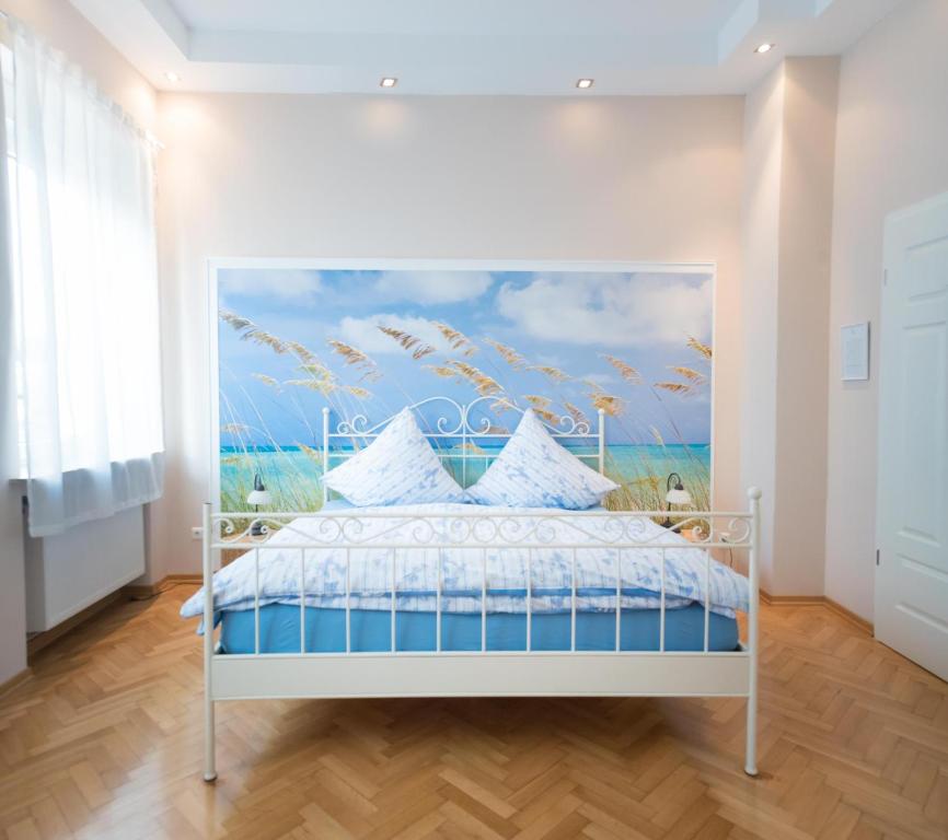 Säng eller sängar i ett rum på Park Villa Gernsheim