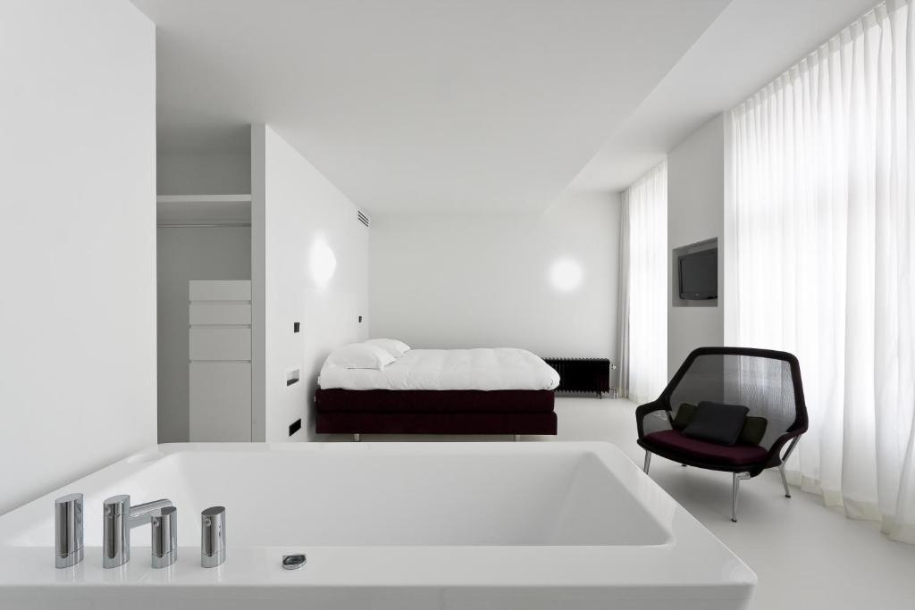 Postel nebo postele na pokoji v ubytování Zenden Hotel Maastricht