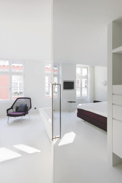 Postel nebo postele na pokoji v ubytování Zenden Hotel Maastricht