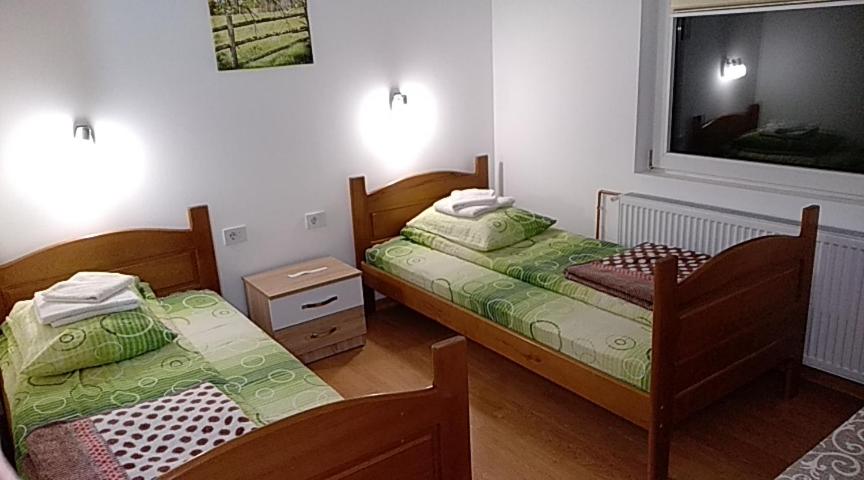 Postel nebo postele na pokoji v ubytování Apartments & Rooms Bojic