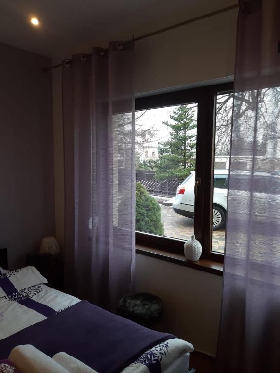 Posteľ alebo postele v izbe v ubytovaní Apartament wSPAniały.