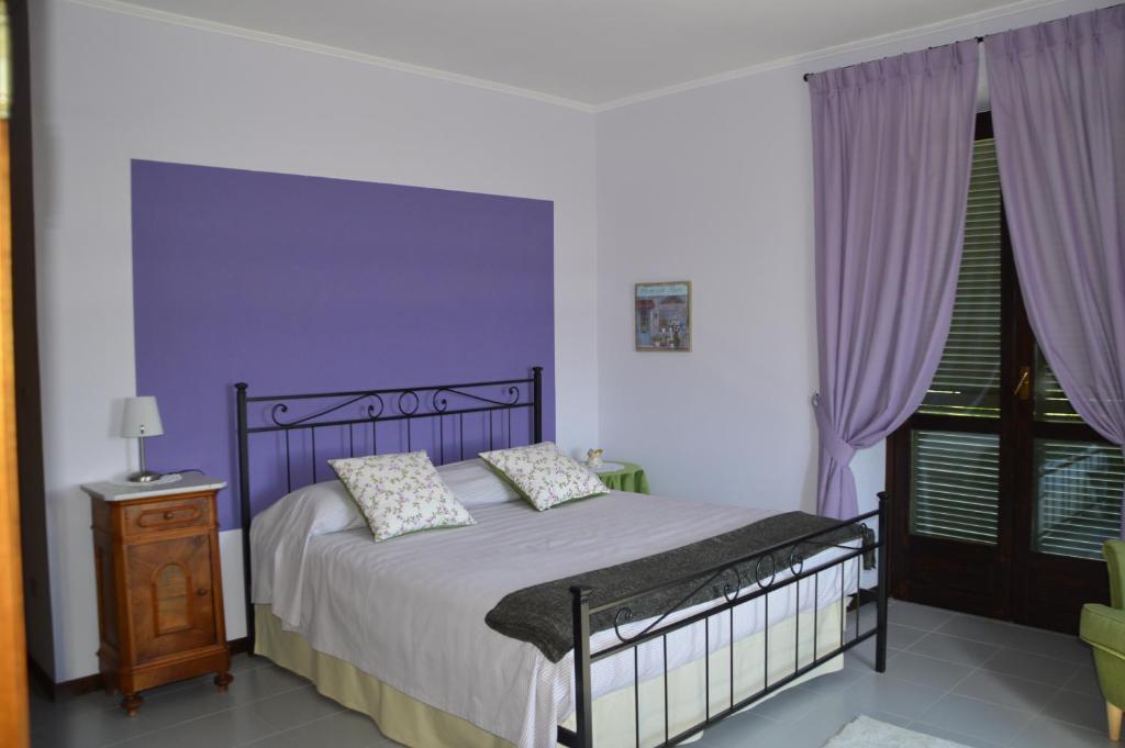 Postel nebo postele na pokoji v ubytování IL SEGNAVENTO