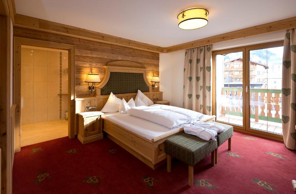 Posteľ alebo postele v izbe v ubytovaní Alpenresort Fluchthorn
