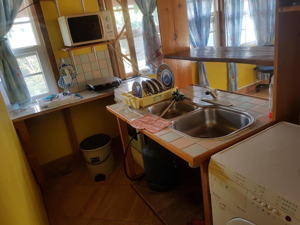 Kuchyň nebo kuchyňský kout v ubytování Coco Mango Suites