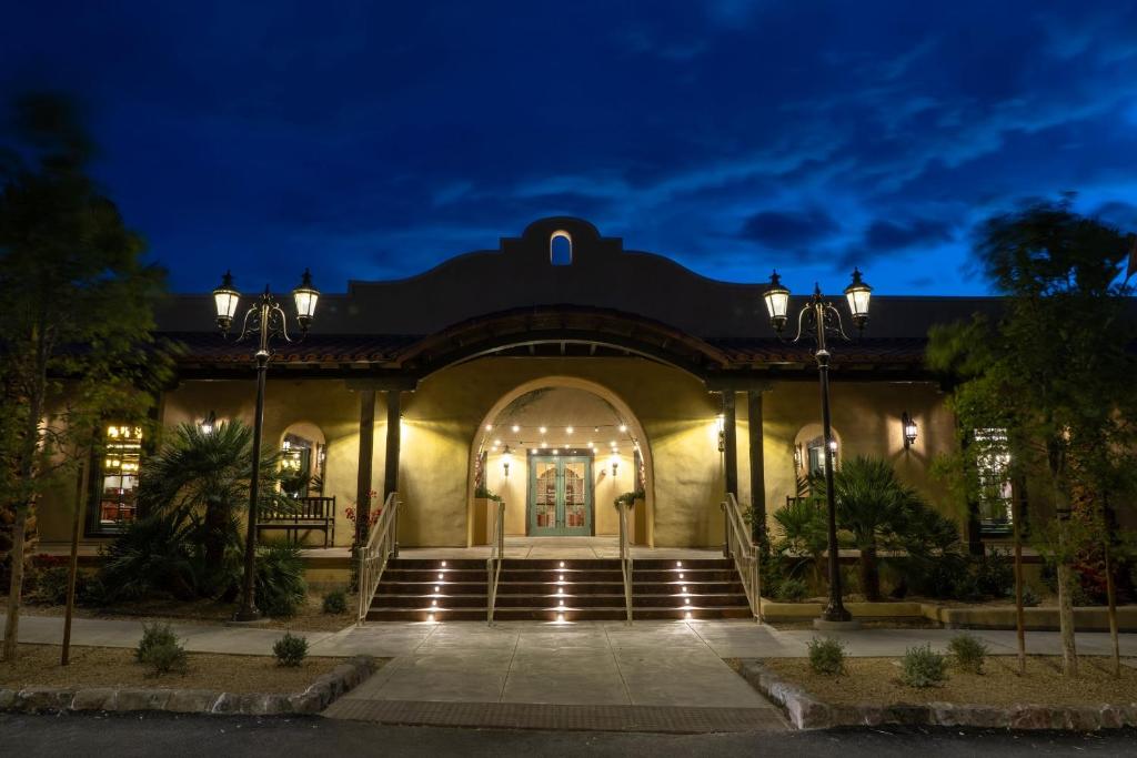 a large building with stairs leading to the front door at The Ranch At Death Valley in Indian Village