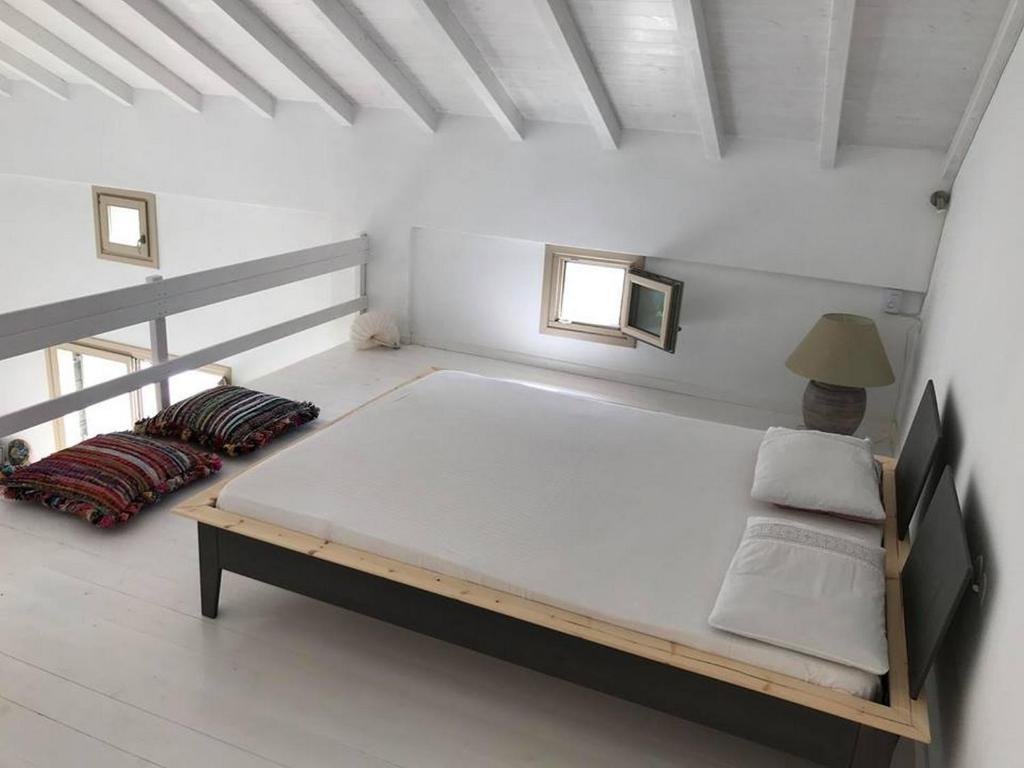 Postel nebo postele na pokoji v ubytování Notus Villa