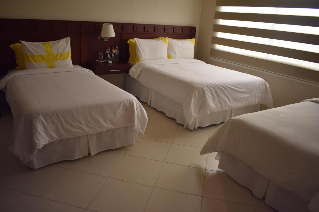 Postel nebo postele na pokoji v ubytování Ceibo Real