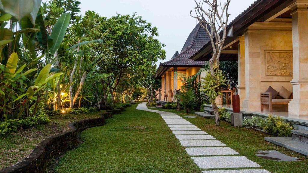 a walkway in front of a house at Masia Villa Ubud in Ubud