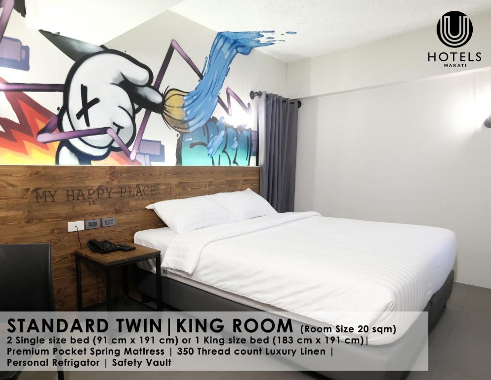 Postel nebo postele na pokoji v ubytování U Hotels Makati