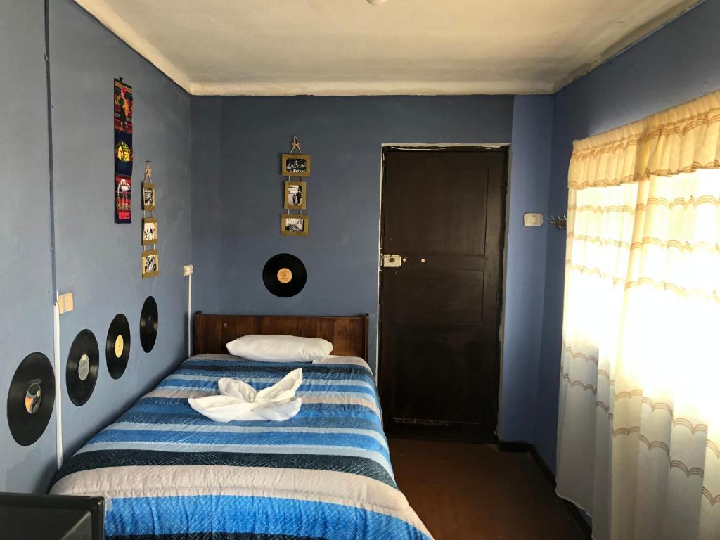 Postel nebo postele na pokoji v ubytování Casa Salkantay Cusco