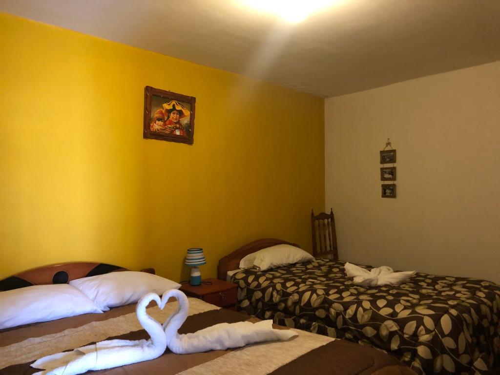 Postel nebo postele na pokoji v ubytování Casa Salkantay Cusco