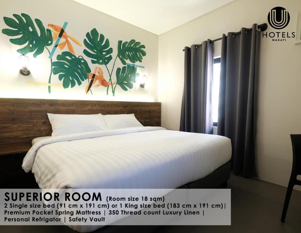 Postel nebo postele na pokoji v ubytování U Hotels Makati
