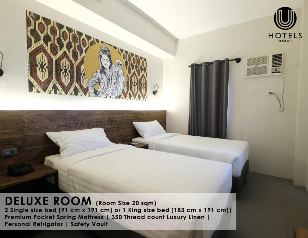 Postel nebo postele na pokoji v ubytování U Hotels Makati