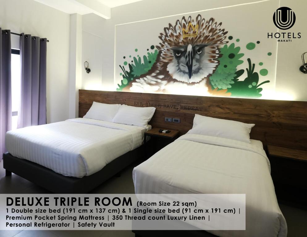 Postel nebo postele na pokoji v ubytování U Hotels Makati
