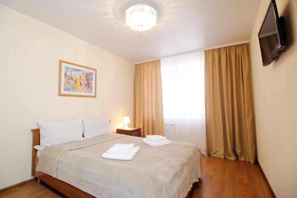 Cama o camas de una habitación en Apartments Tomsk House