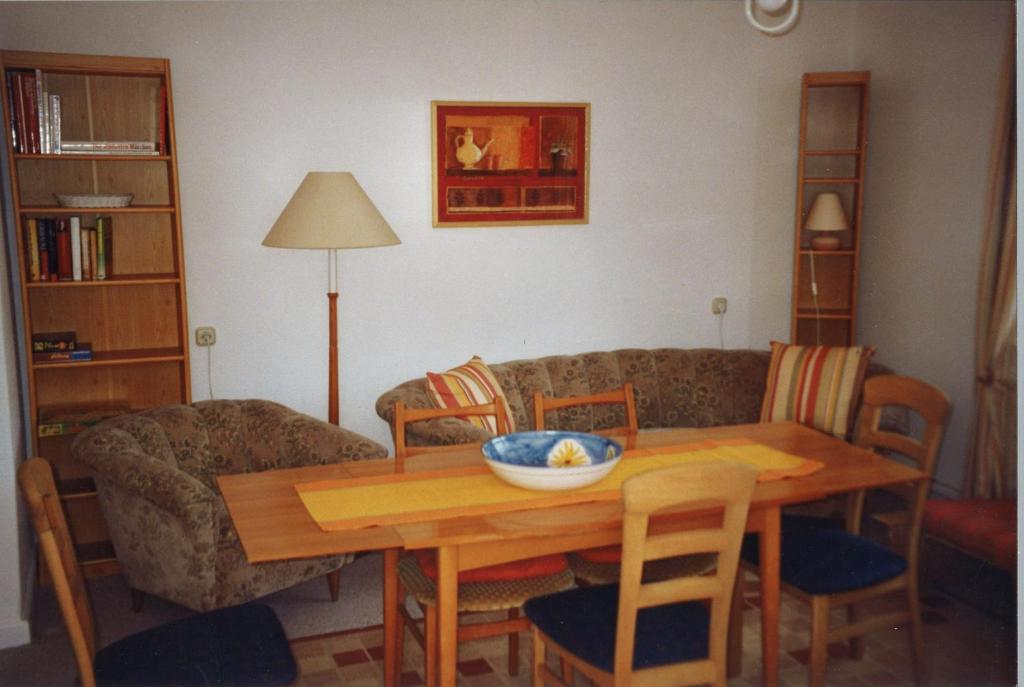 a living room with a table and a couch at von Frieling in Soltau