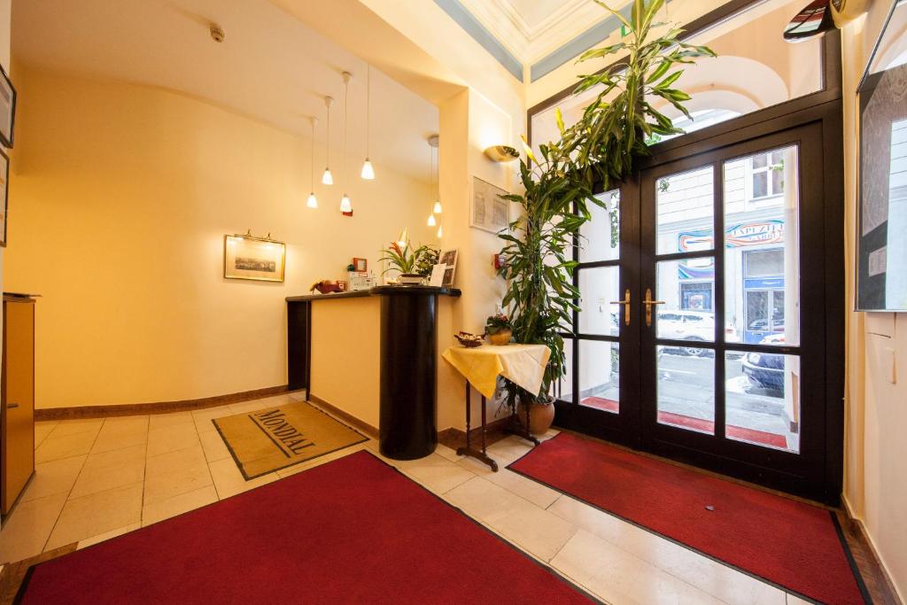 Łóżko lub łóżka w pokoju w obiekcie Mondial Appartement Hotel