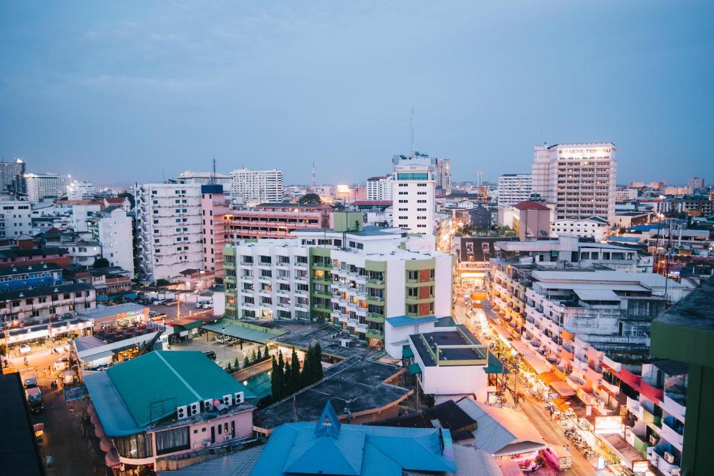 a city at night with many tall buildings at Marine Plaza Hotel Pattaya in Pattaya South